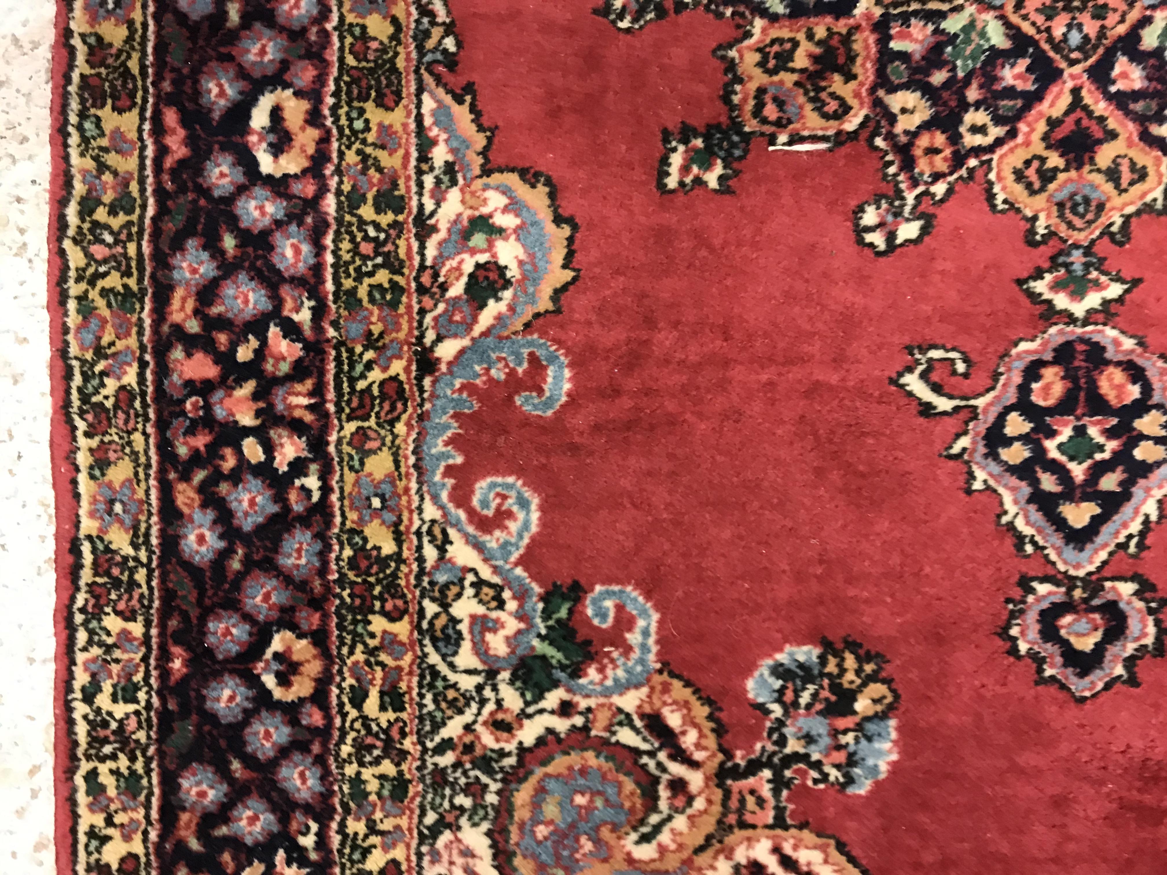 A pair of fine Oriental rugs, the central panels set with floral decorated circular medallion on a - Image 15 of 41