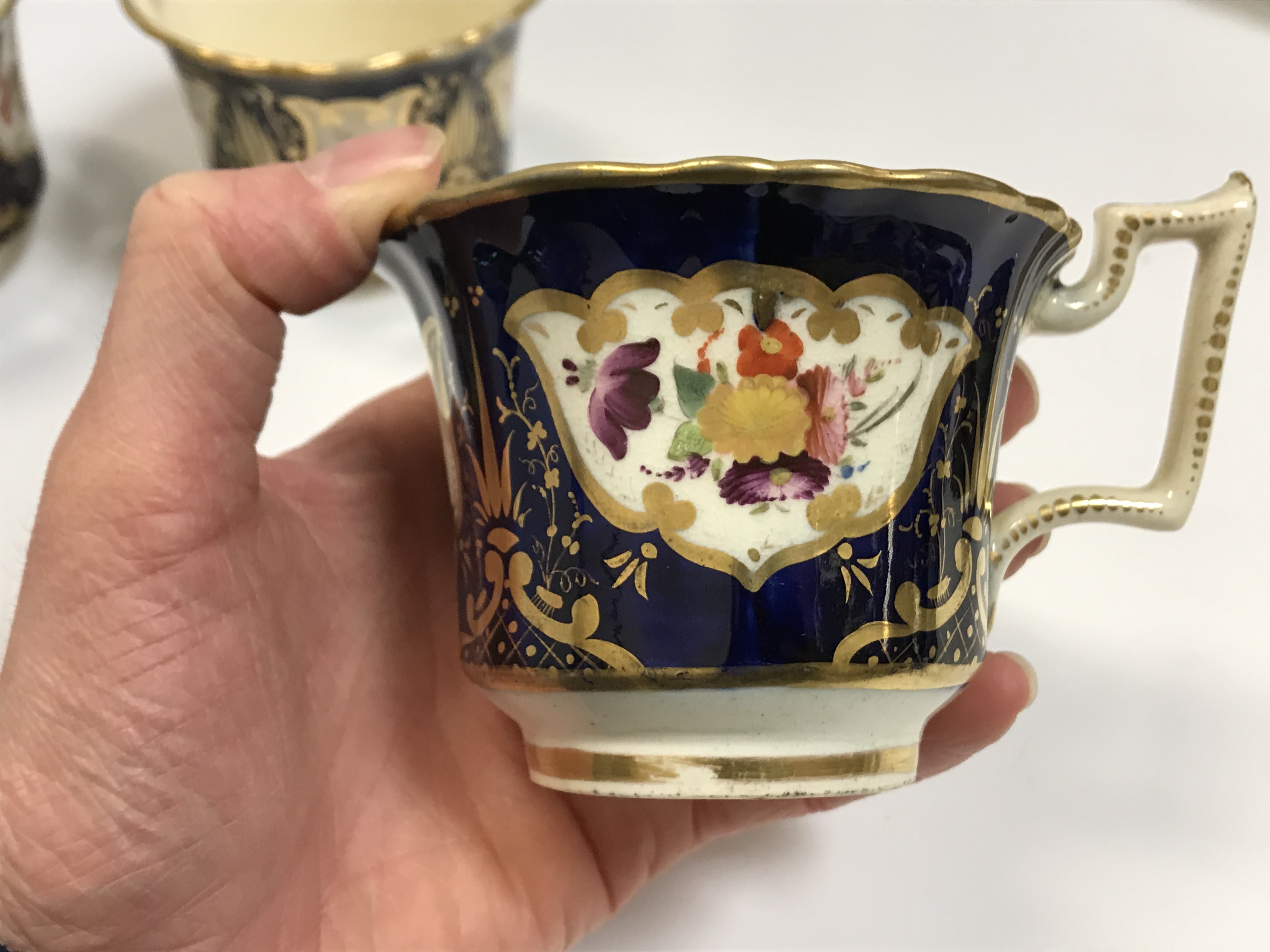 A 19th Century Staffordshire pottery part tea set, royal blue banded and gilt lined with panels of - Image 30 of 45
