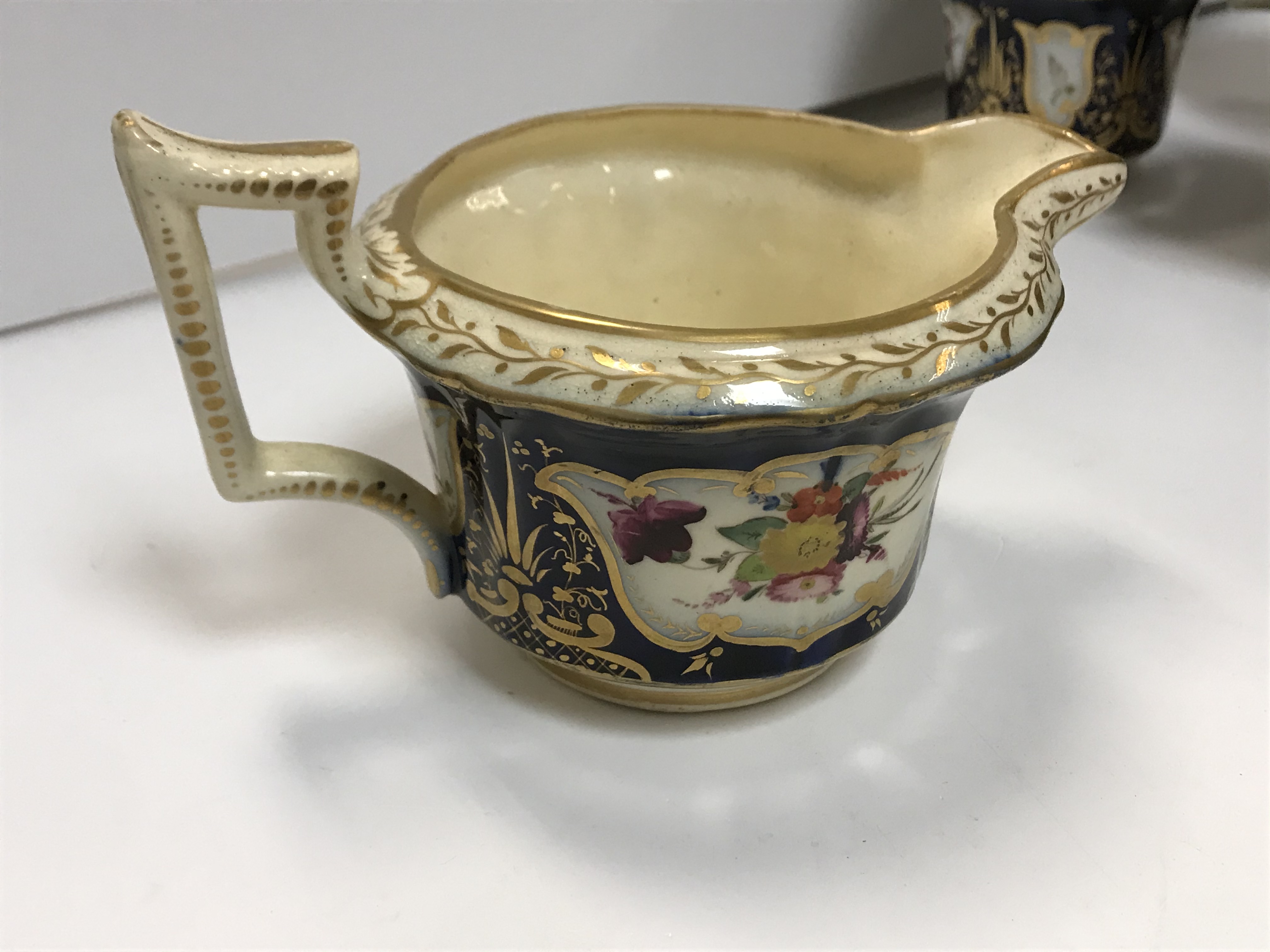 A 19th Century Staffordshire pottery part tea set, royal blue banded and gilt lined with panels of - Image 33 of 45