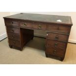 An early 19th Century mahogany double pedestal desk, the tooled and silvered leather insert top over