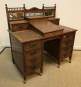 A Victorian mahogany double pedestal desk, the raised superstructure with mirrored back and