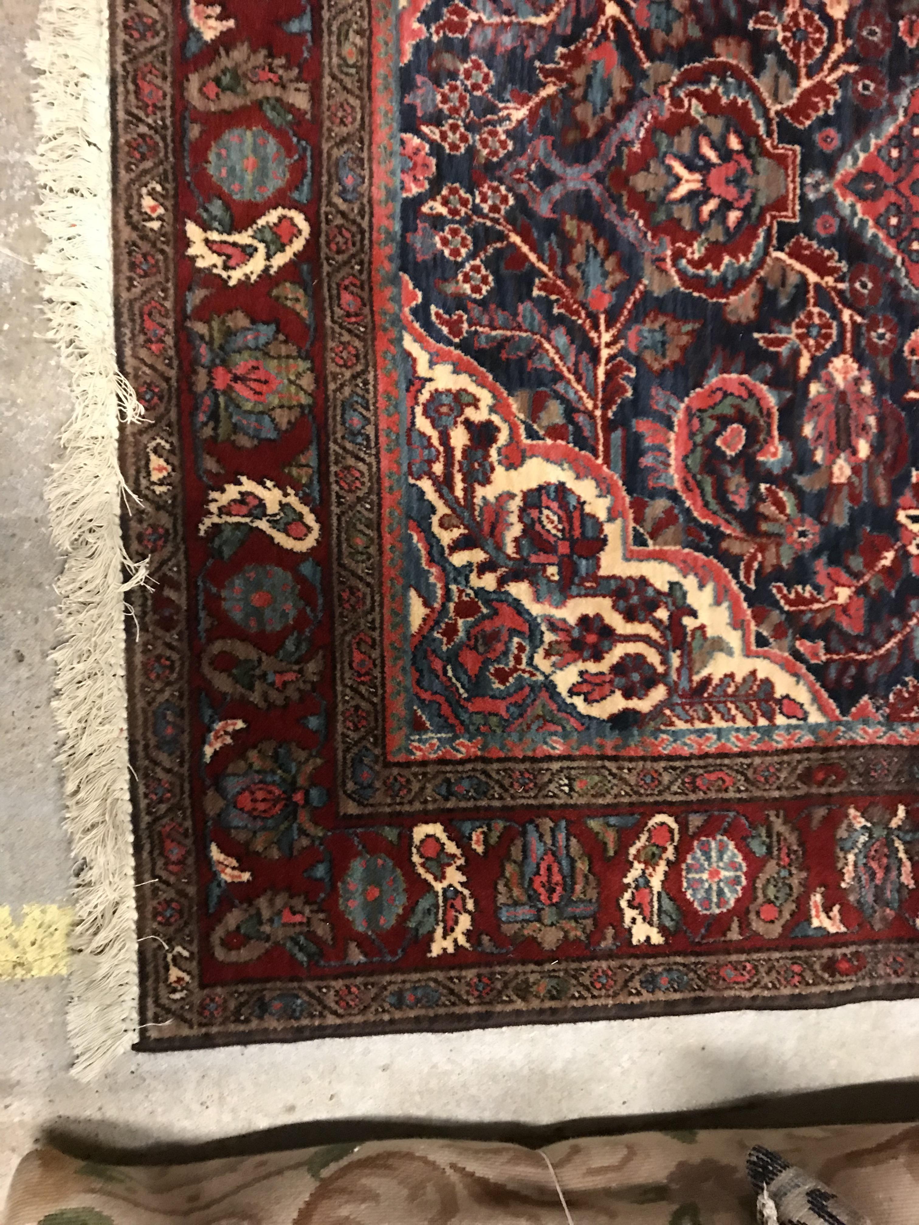 An Oriental carpet, the central panel set with foliate decorated medallion on a red and blue - Image 3 of 11