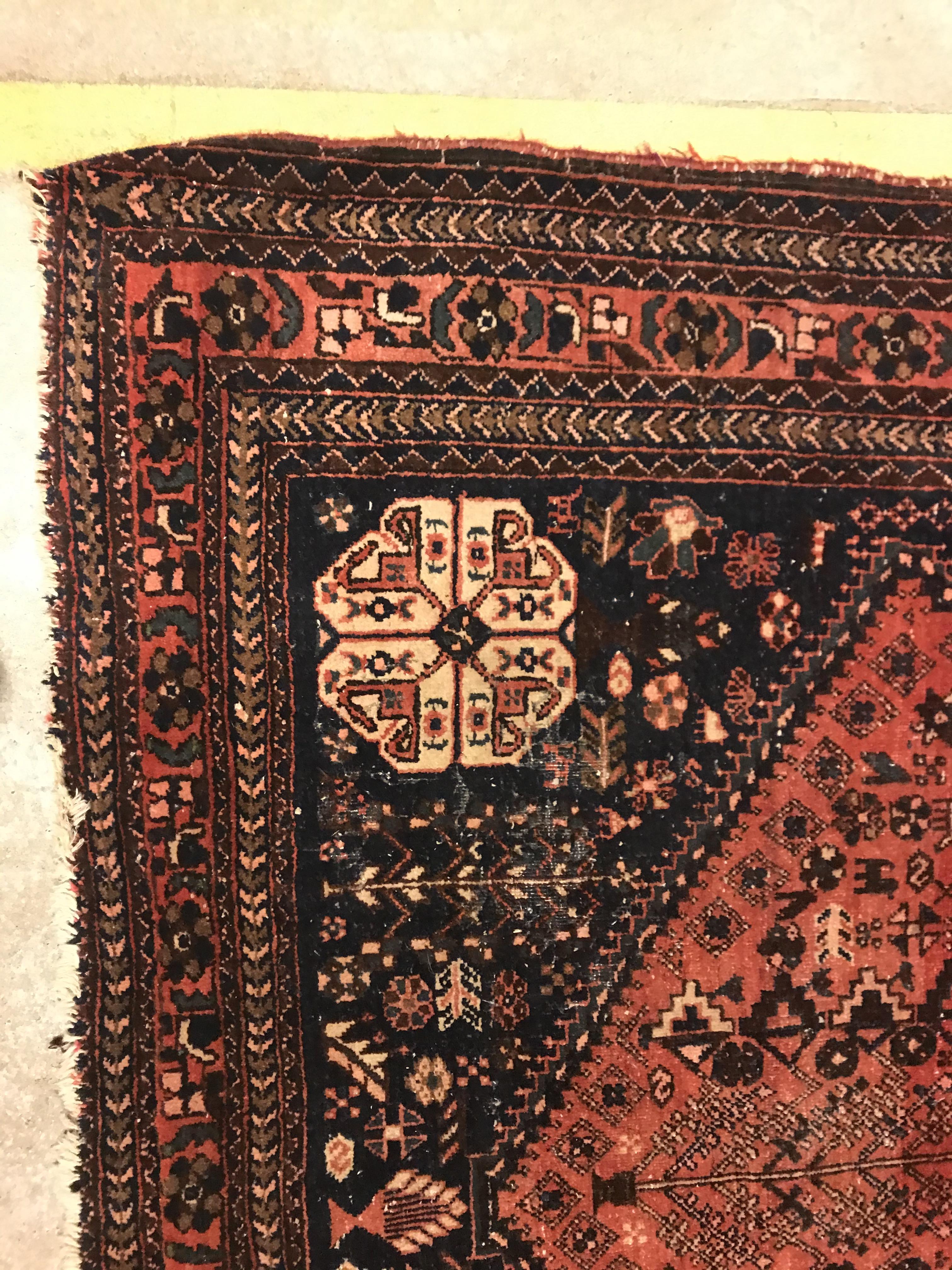 A Caucasian rug, the central panel set with three repeating medallions on a pale blue ground, within - Image 15 of 33
