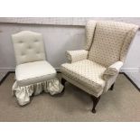 A modern upholstered wing back scroll armchair on stained beech cabriole front legs, a modern
