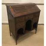 A circa 1900 "Medina" Arts & Crafts oak bureau, the sloping fall with moulded decoration opening