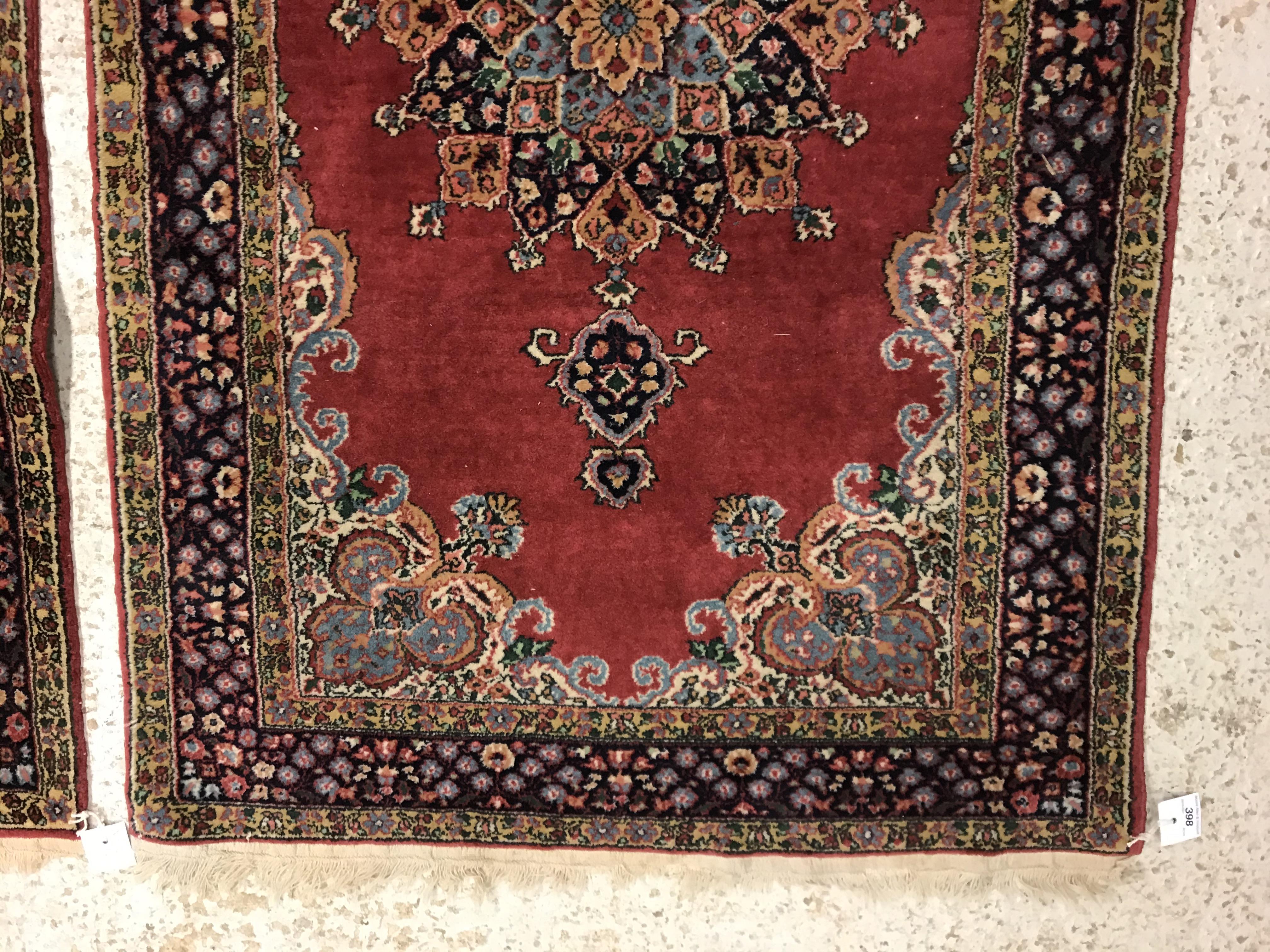 A pair of fine Oriental rugs, the central panels set with floral decorated circular medallion on a - Image 4 of 41