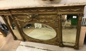 A 19th Century giltwood and gesso framed overmantel mirror with central oval plate and floral swag