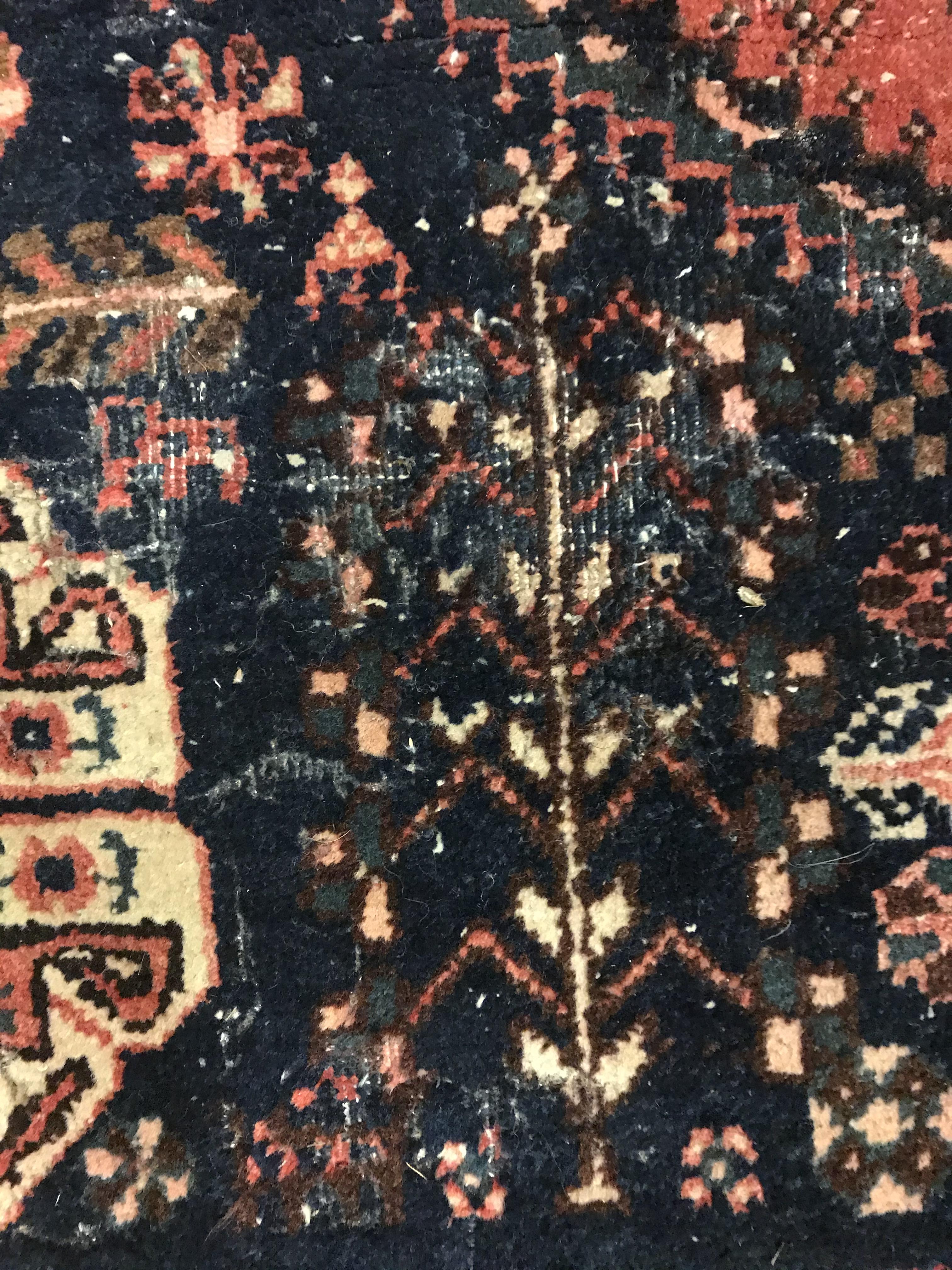 A Caucasian rug, the central panel set with three repeating medallions on a pale blue ground, within - Image 23 of 33