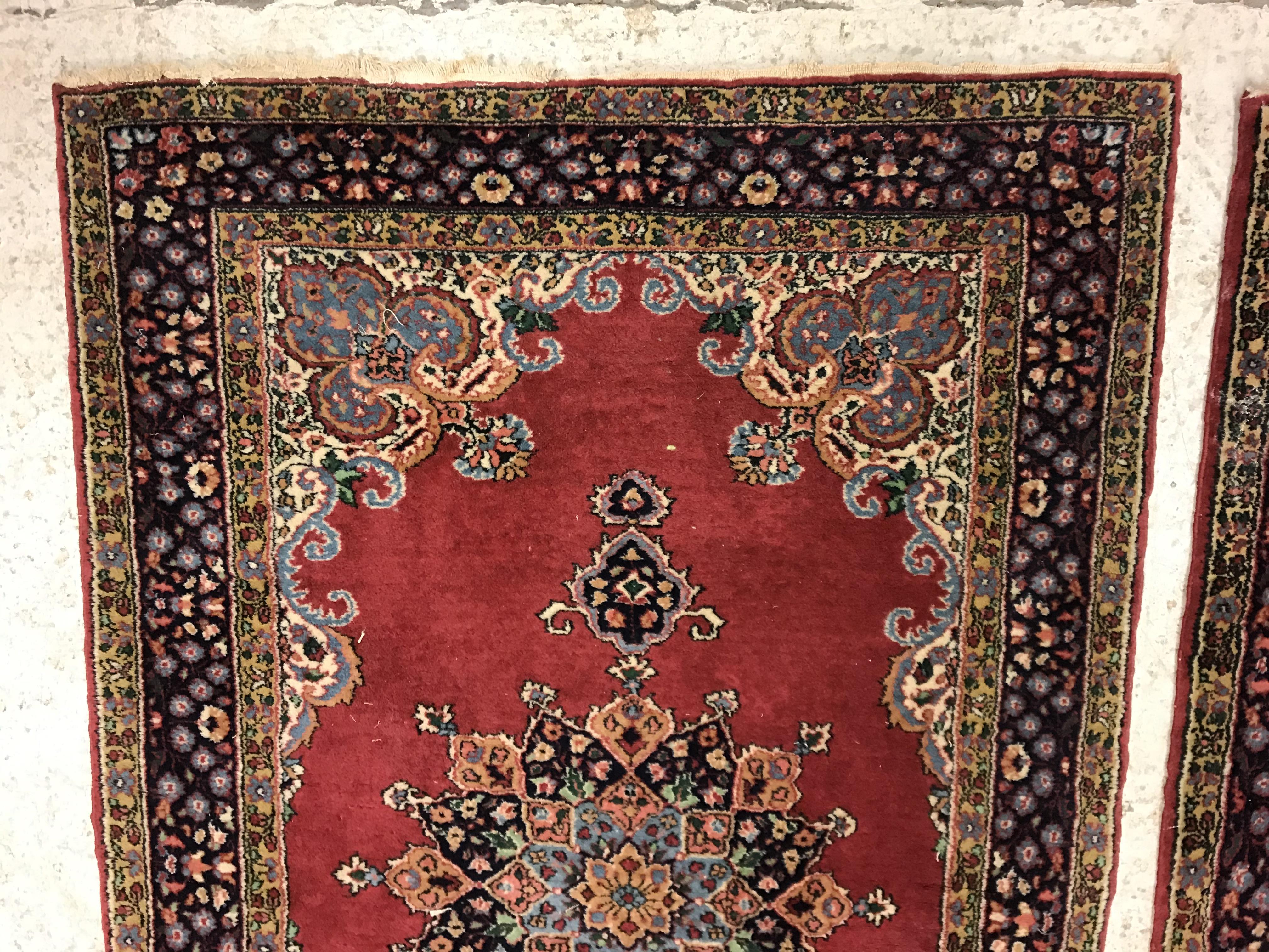 A pair of fine Oriental rugs, the central panels set with floral decorated circular medallion on a - Image 2 of 41