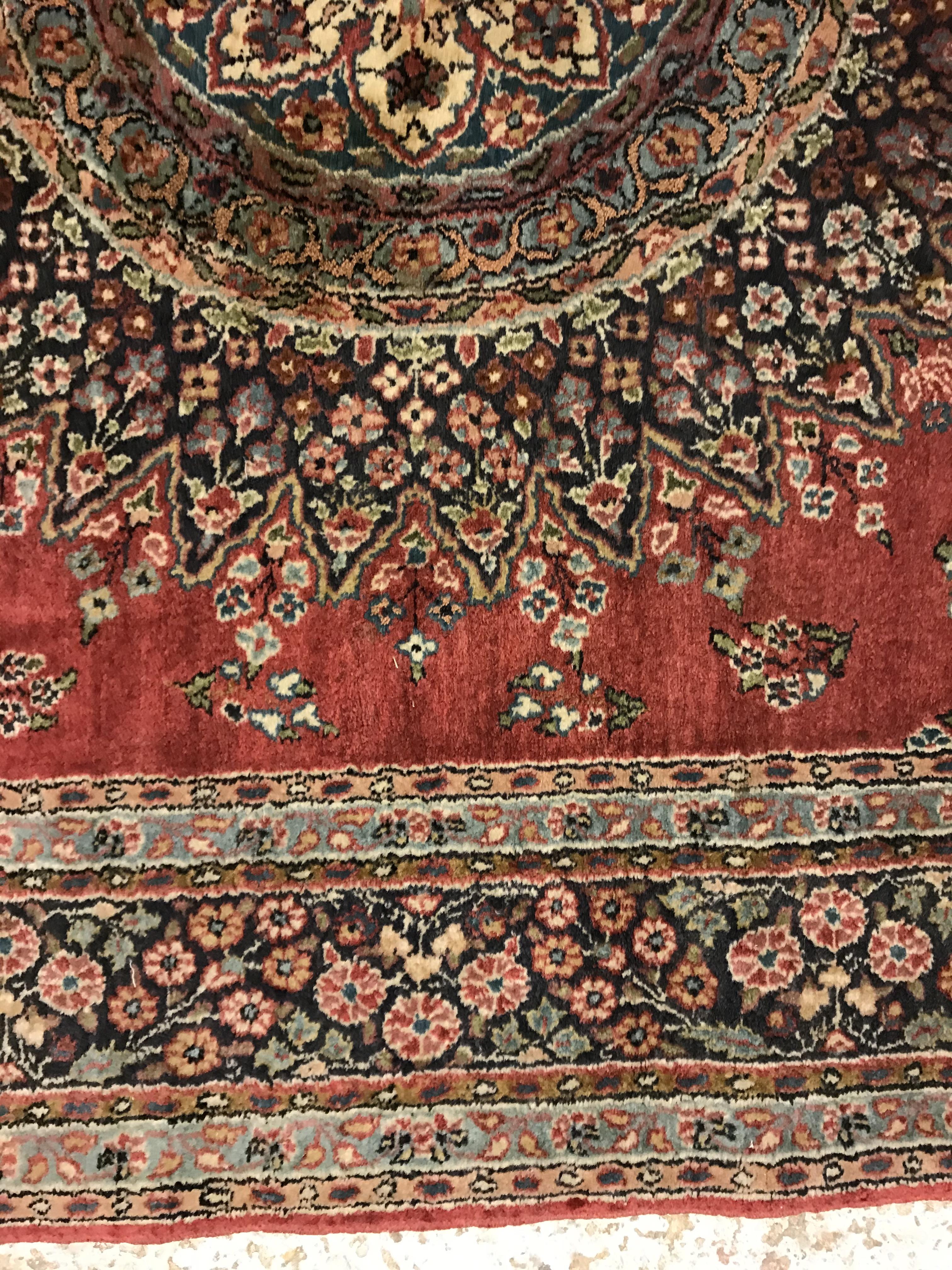 A pair of fine Oriental rugs, the central panel set with floral decorated circular medallion on a - Image 22 of 48