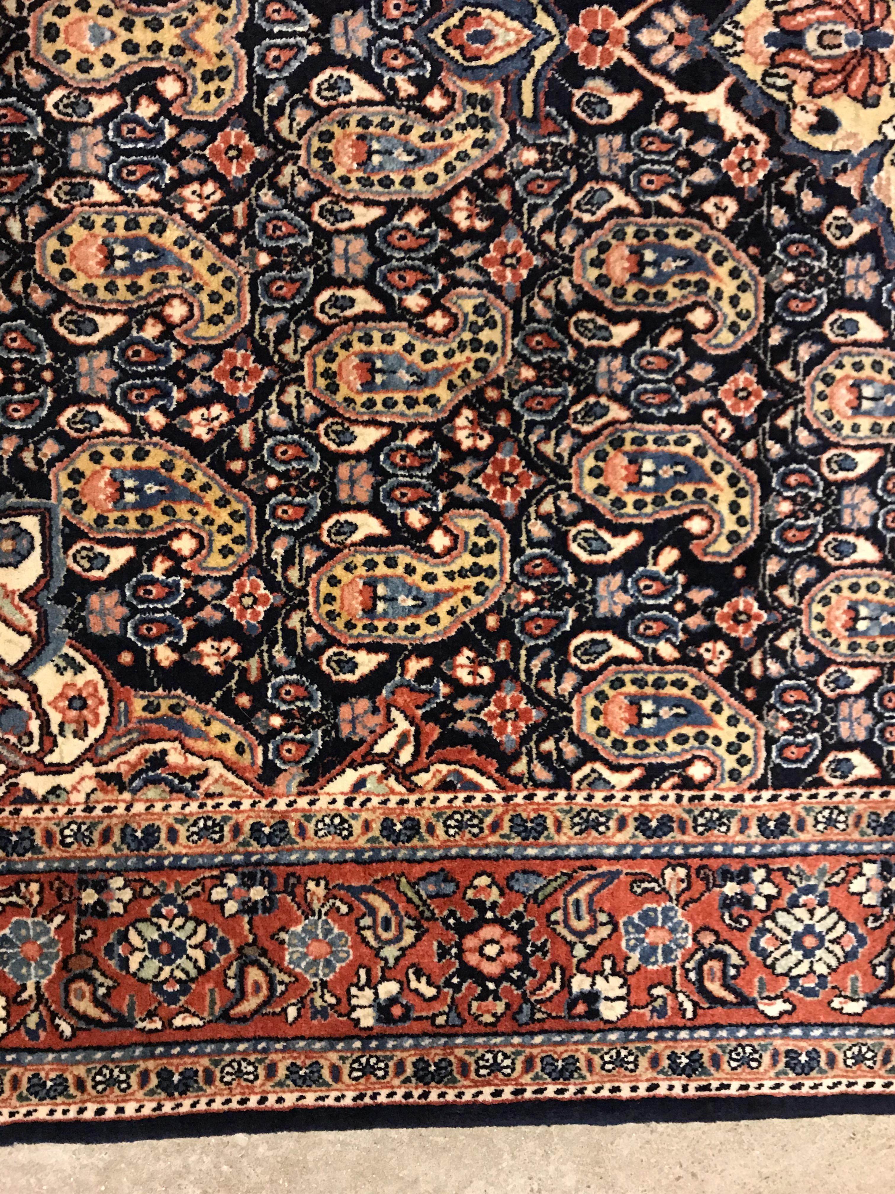 A Kashan carpet, the central panel set with floral decorated medallion on a dark blue hook decorated - Image 5 of 14