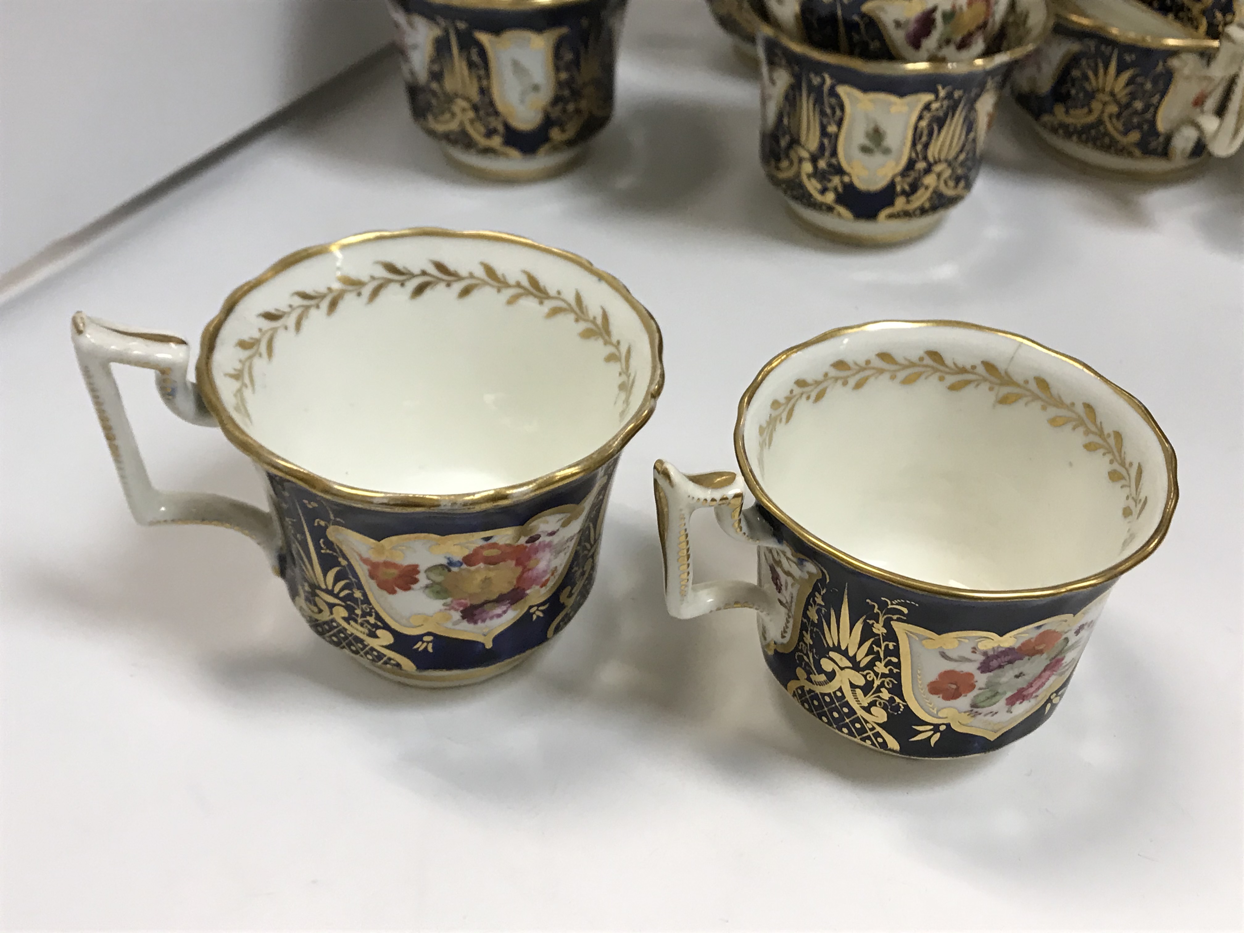 A 19th Century Staffordshire pottery part tea set, royal blue banded and gilt lined with panels of - Image 31 of 45