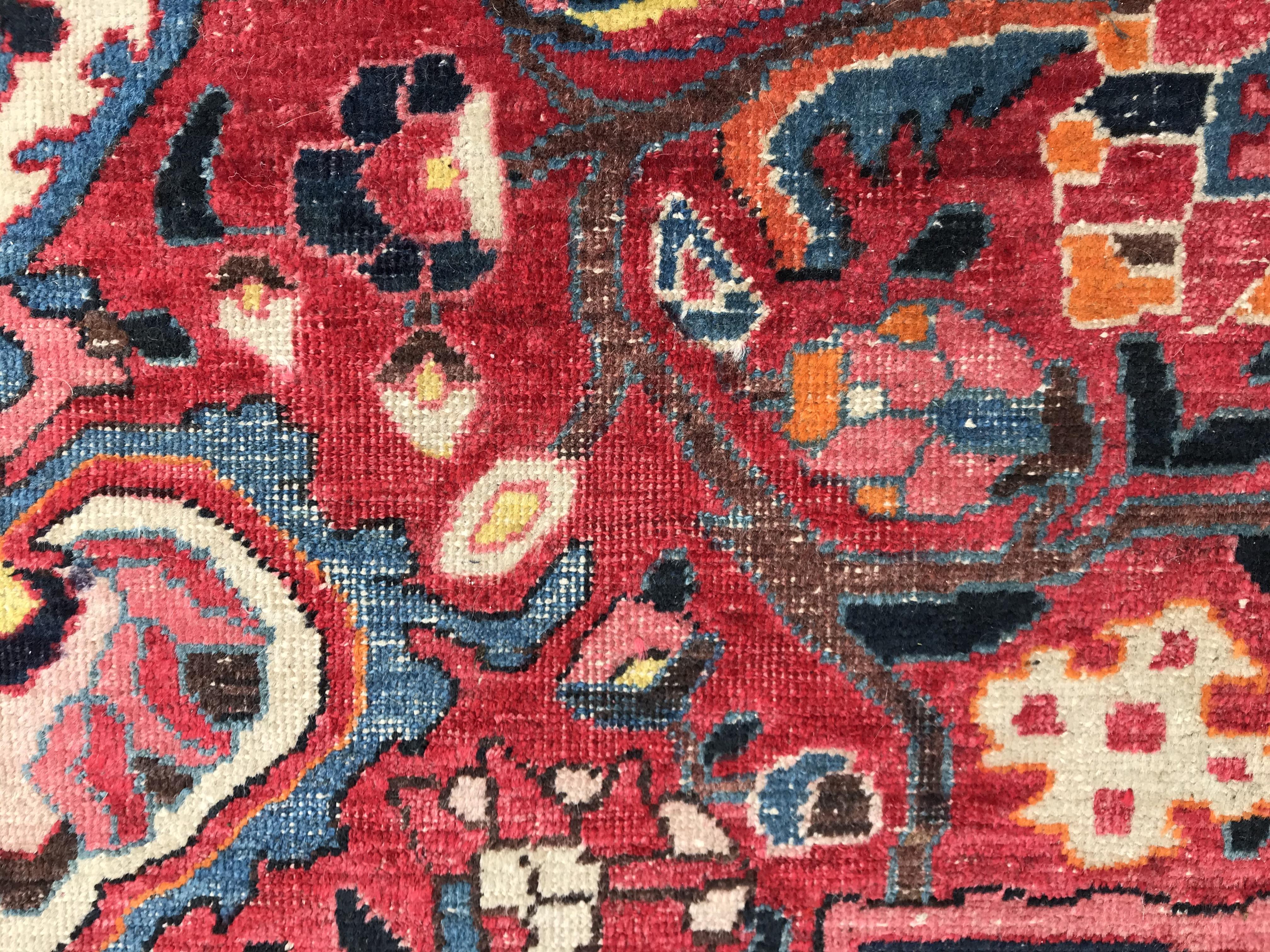 A Caucasian carpet, the central panel set with a flower head medallion on a red ground, with all - Image 5 of 10