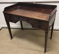 A 19th Century mahogany washstand, the three quarter galleried top over a central drawer flanked