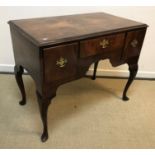 An early 20th Century burr walnut side table or lowboy in the early 18th Century manner, the