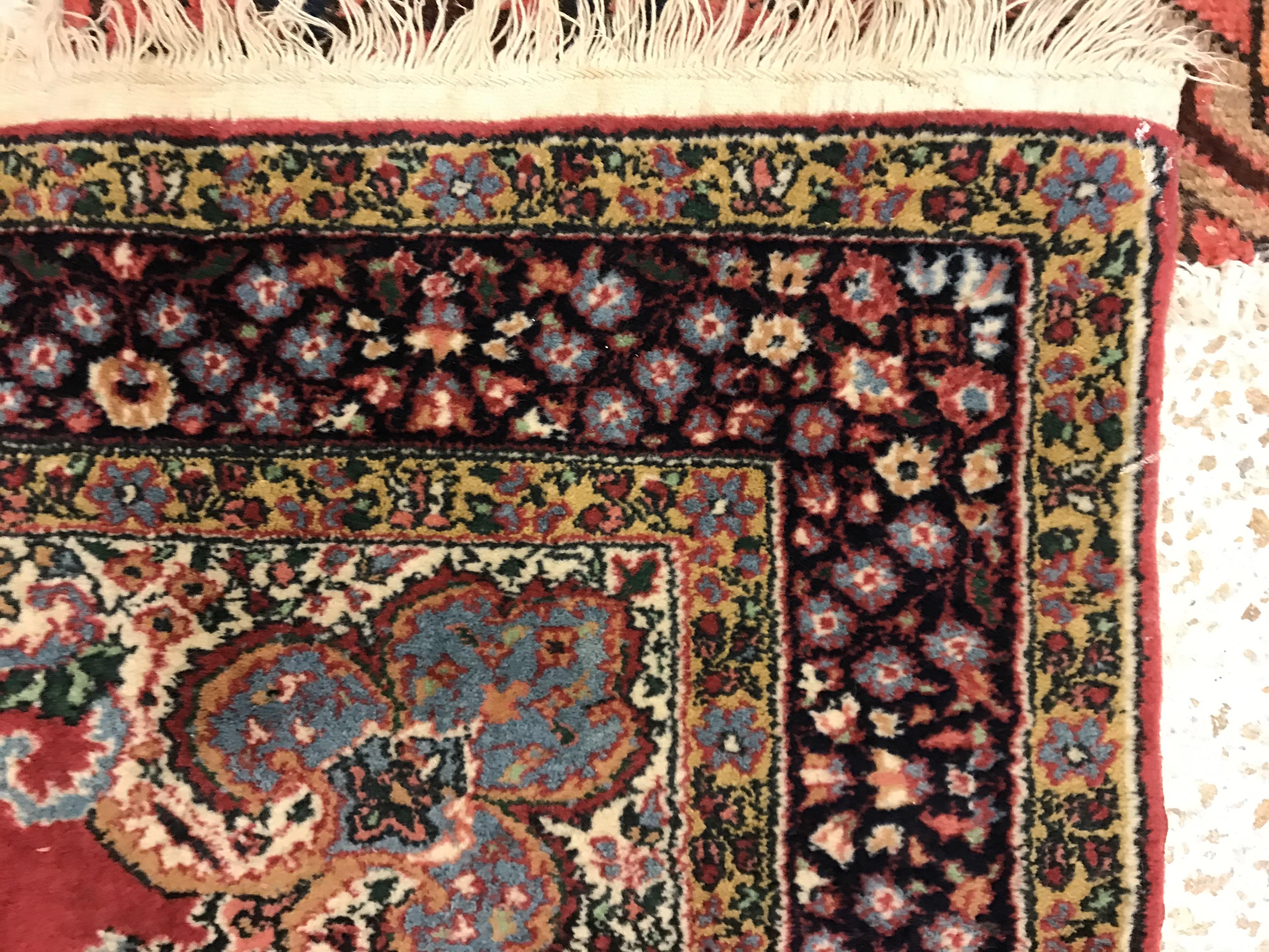 A pair of fine Oriental rugs, the central panels set with floral decorated circular medallion on a - Image 6 of 41