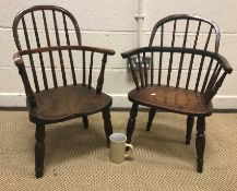 Two 19th Century Thames Valley children's stick back elbow chairs with shaped seats on splayed