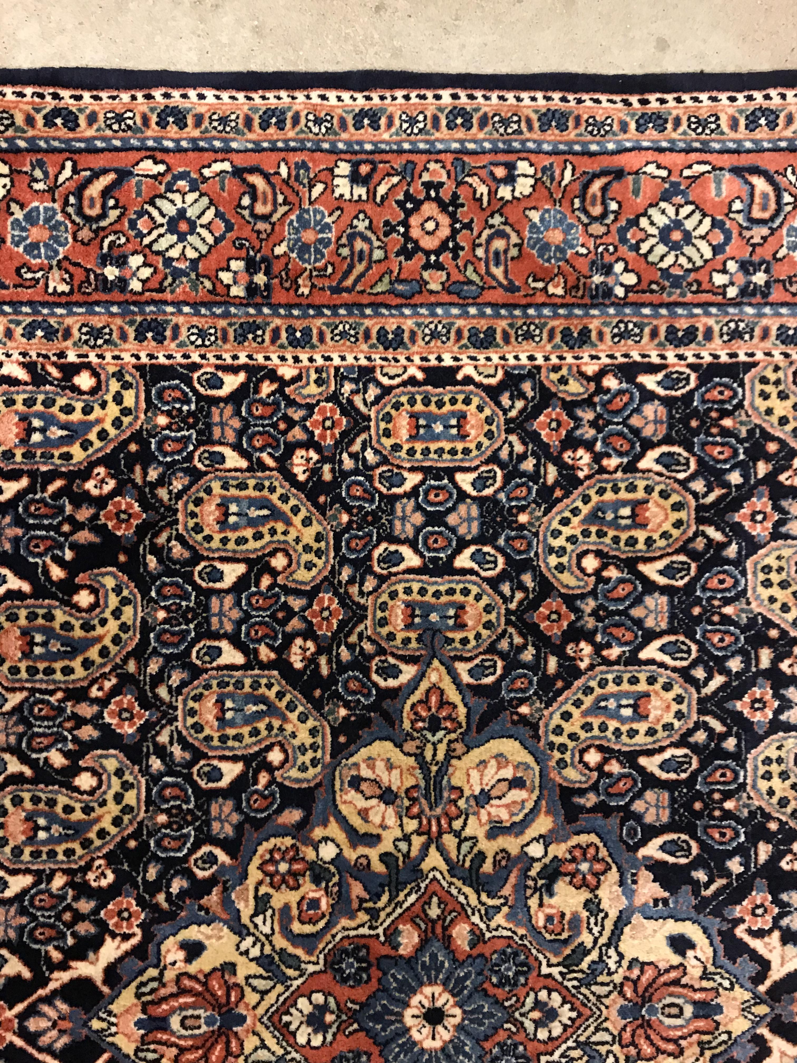 A Kashan carpet, the central panel set with floral decorated medallion on a dark blue hook decorated - Image 7 of 14