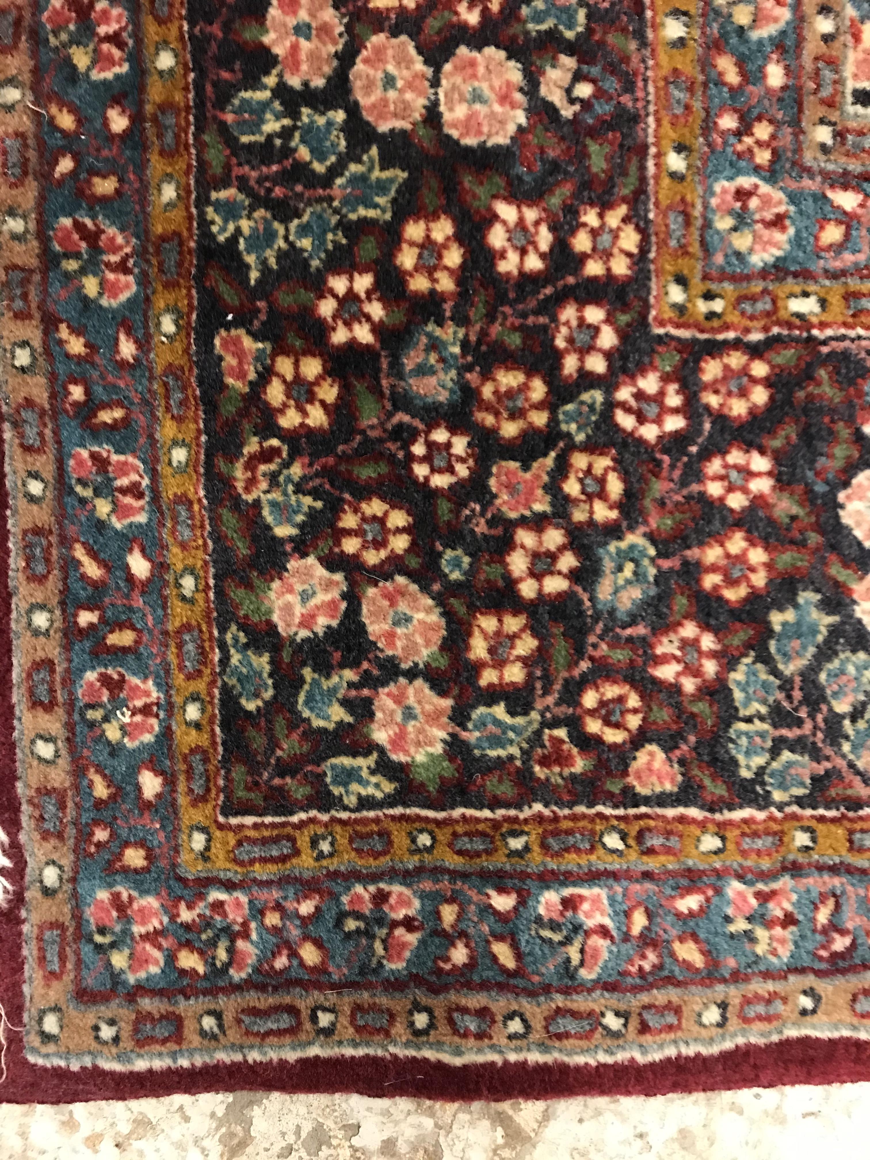 A pair of fine Oriental rugs, the central panels each set with floral decorated circular medallion - Image 15 of 41