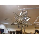 A modern glass and metal bound hall lantern of starburst form, approx 46 cm long