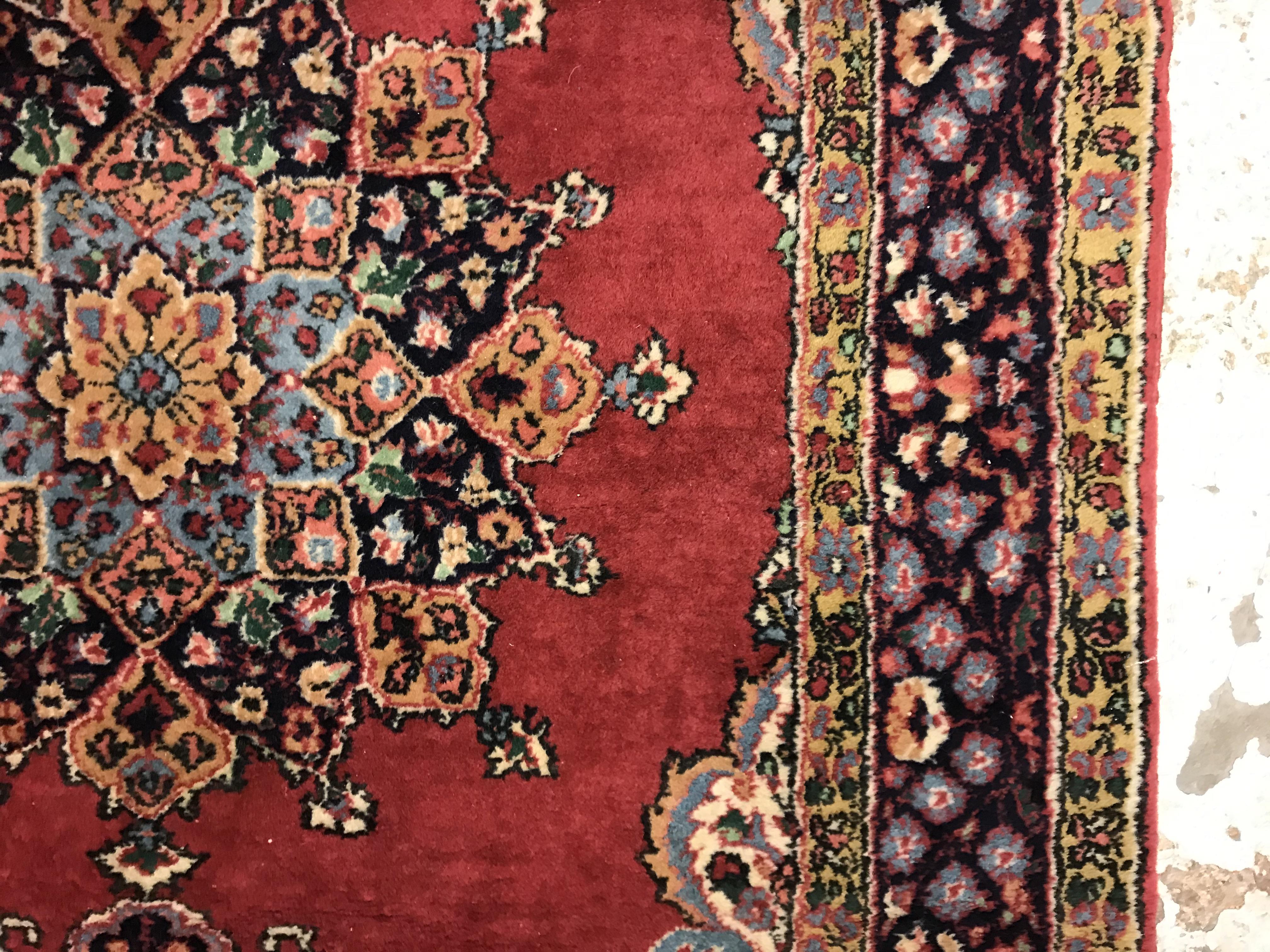 A pair of fine Oriental rugs, the central panels set with floral decorated circular medallion on a - Image 12 of 41