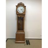 An Irish Victorian oak cased long case clock, the eight day movement with circular enamelled dial