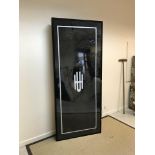A modern black painted metal framed double-sided light box / advertising sign, bearing monogram "
