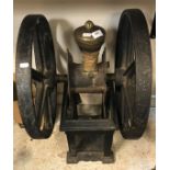 A Victorian cast iron and brass double fly wheel coffee grinder, 70 cm high