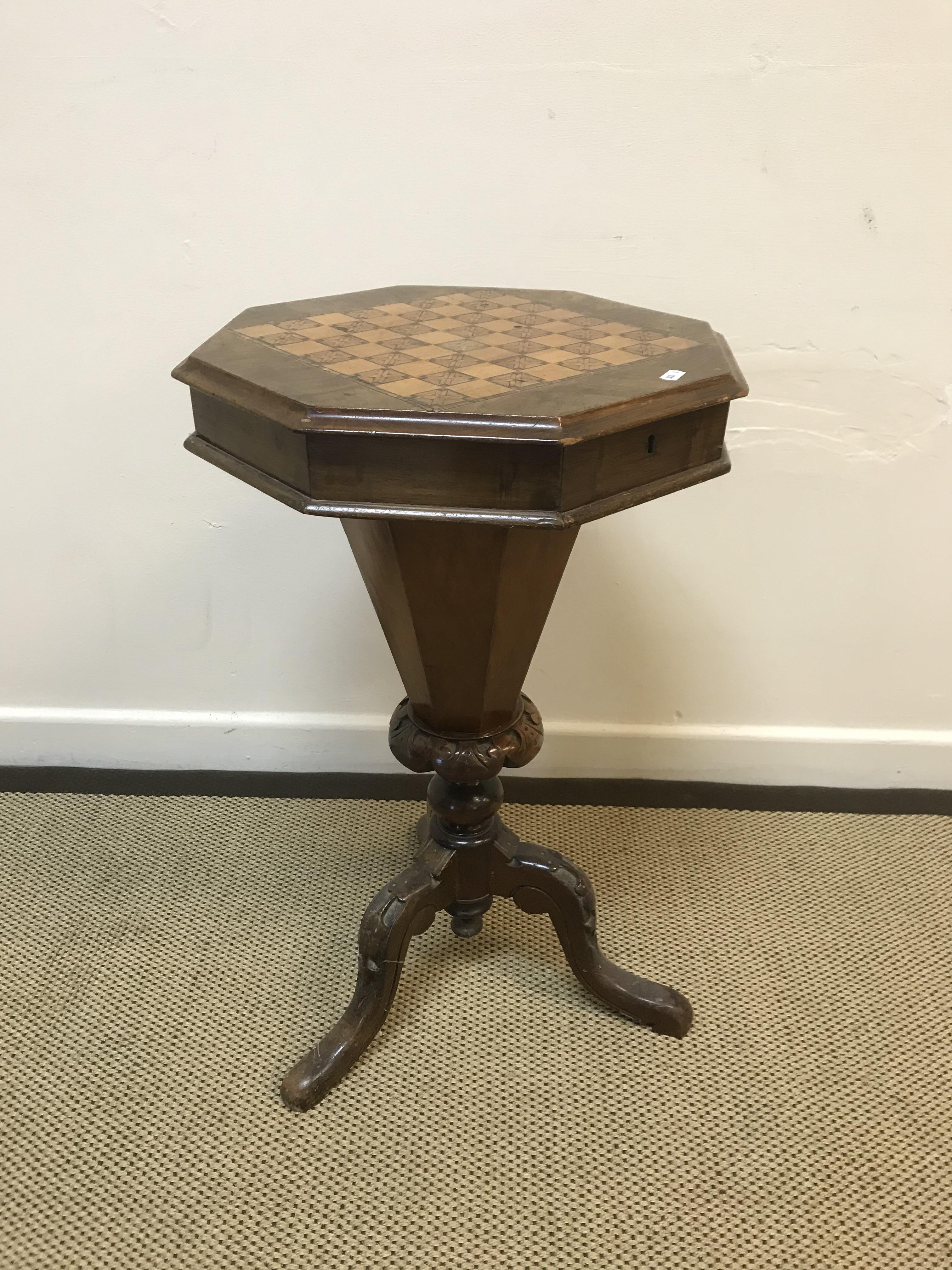 A Victorian walnut and parquetry games top trumpet-shaped work table, the rising top opening to