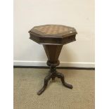 A Victorian walnut and parquetry games top trumpet-shaped work table, the rising top opening to