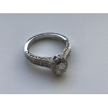 A modern 18 carat white gold diamond and sapphire set "Love" ring by Vera Wang, 0.95 carat weight,