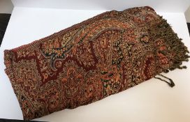 A modern Paisley design red ground shawl / table cover, 432 cm x 500 cm approx