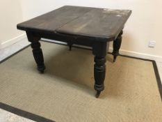 A Victorian oak extending dining table of square form, 104 cm x 104 cm x 75 cm high, an early to mid