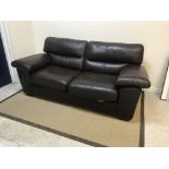 A modern brown leather upholstered two seat sofa on square tapered supports, approx 208 cm wide x 99