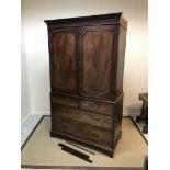 A 19th Century mahogany linen press, the upper section with moulded and notch carved cornice over