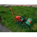 A Suffolk Super Punch Dual Drive petrol driven cylinder lawnmower with grass catcher