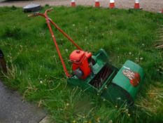 A Suffolk Super Punch Dual Drive petrol driven cylinder lawnmower with grass catcher