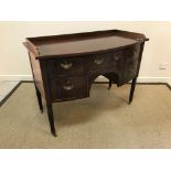 A circa 1900 mahogany bow fronted sideboard by W Williamson & Sons of Guildford, the three quarter