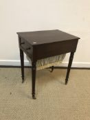 A mahogany work table, the plain top over a single end drawer and fabric covered work basket