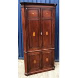 An Edwardian mahogany and inlaid free-standing corner cupboard, the upper doors with fan marquetry