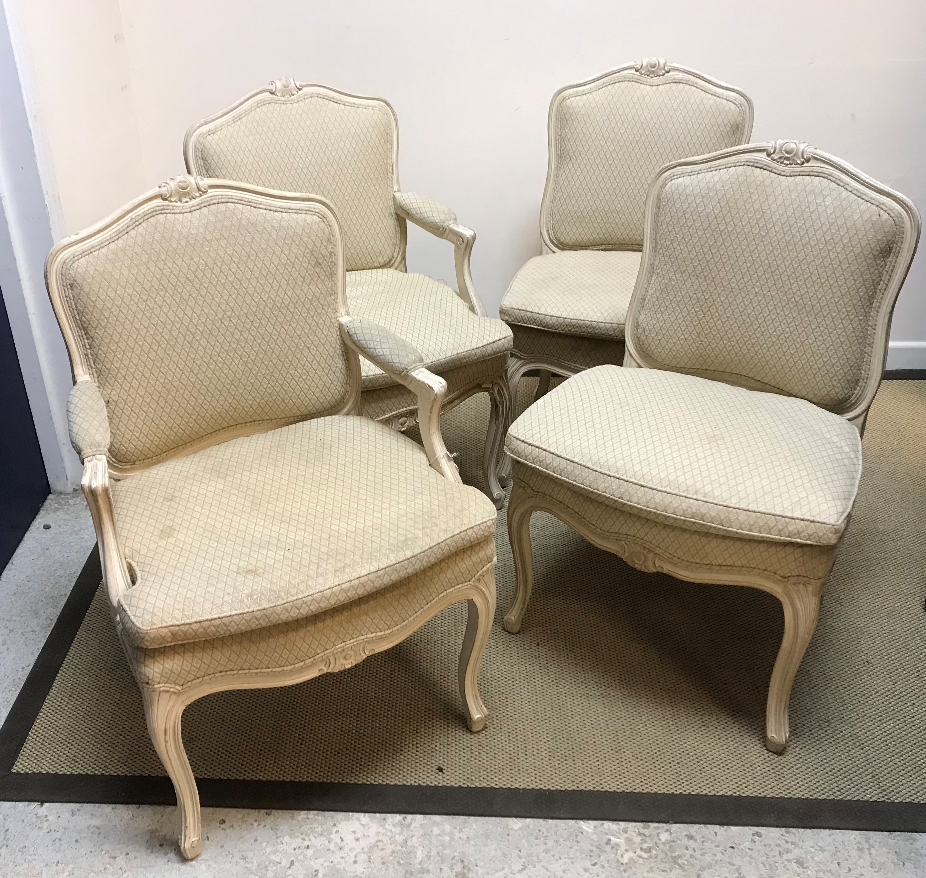 A pair of early 20th Century painted beech framed elbow chairs in the Louis XV taste, together