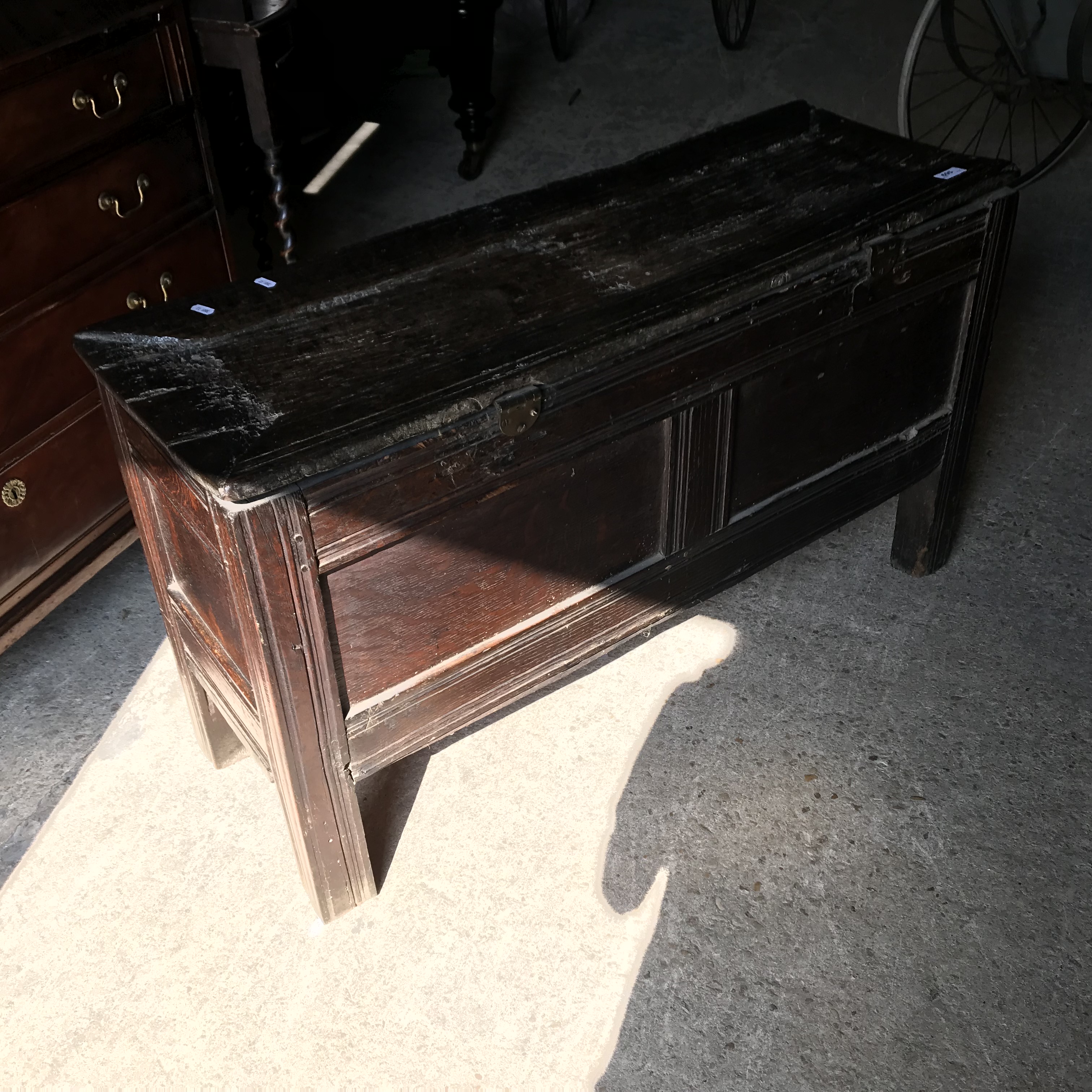 An 18th Century oak coffer, the single piece carved plank top over a three panel front with - Image 11 of 24