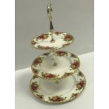 A Royal Albert "Old Country Roses" bone china tea set comprising three tier cake stand, four cups,