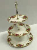 A Royal Albert "Old Country Roses" bone china tea set comprising three tier cake stand, four cups,
