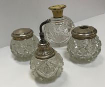 A collection of various cut and other glass silver or white metal mounted dressing table jars and
