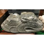 A carved polyphant stone dragon head in the Maori or Polynesian style by Sheila Mead, signed with