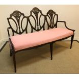 A circa 1900 mahogany and painted three seat salon settee in the Sheraton Revival taste, the