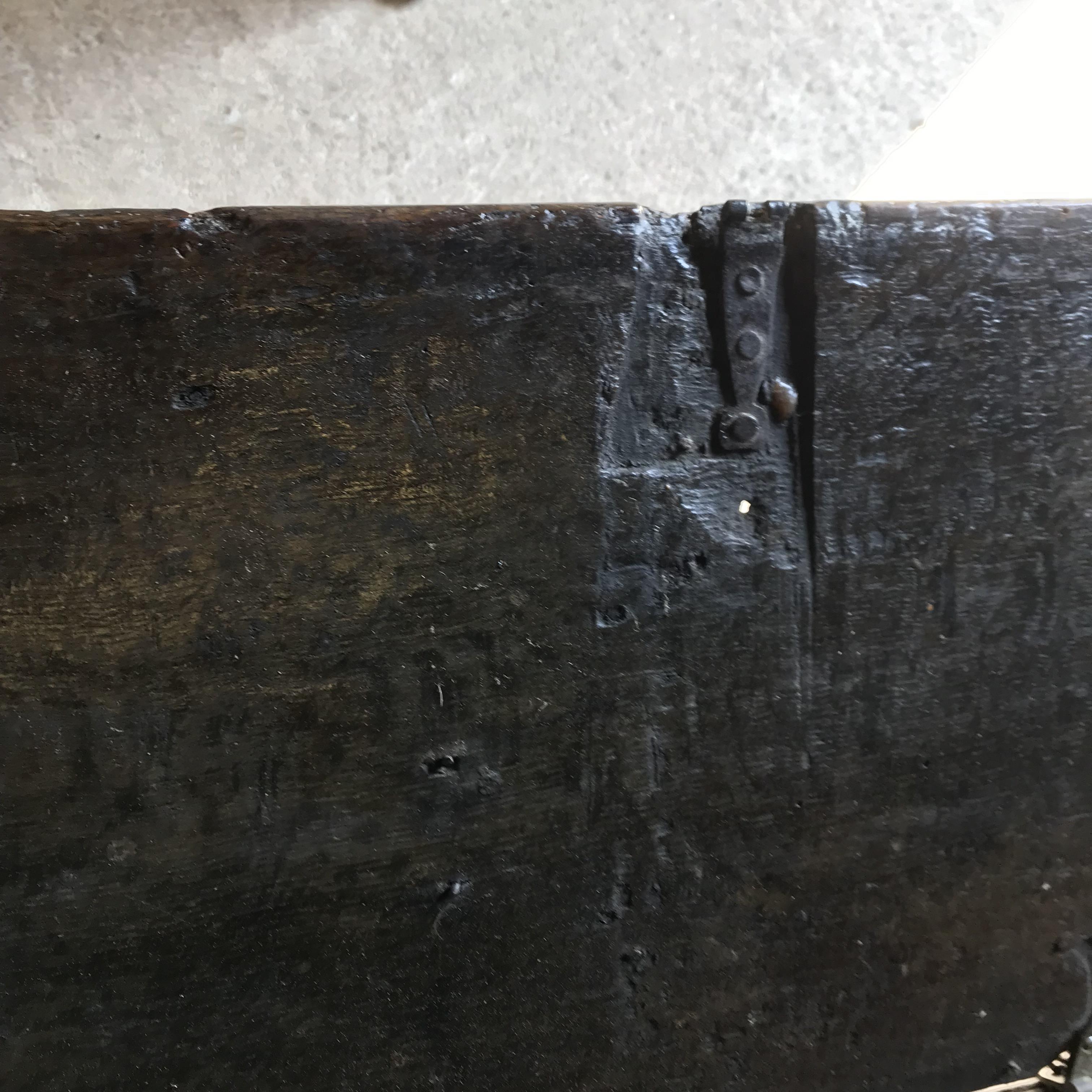 An 18th Century oak coffer, the single piece carved plank top over a three panel front with - Image 15 of 24