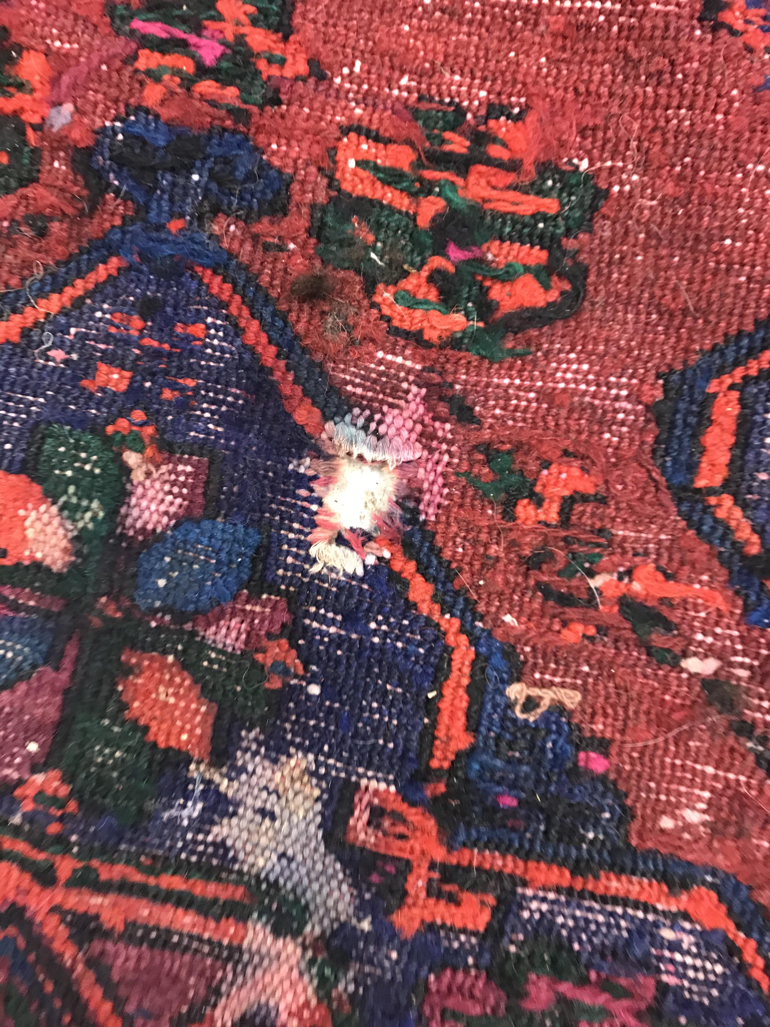 A Persian rug with three repeating lozenge medallions on a red and blue ground, within a blue, red - Image 20 of 20