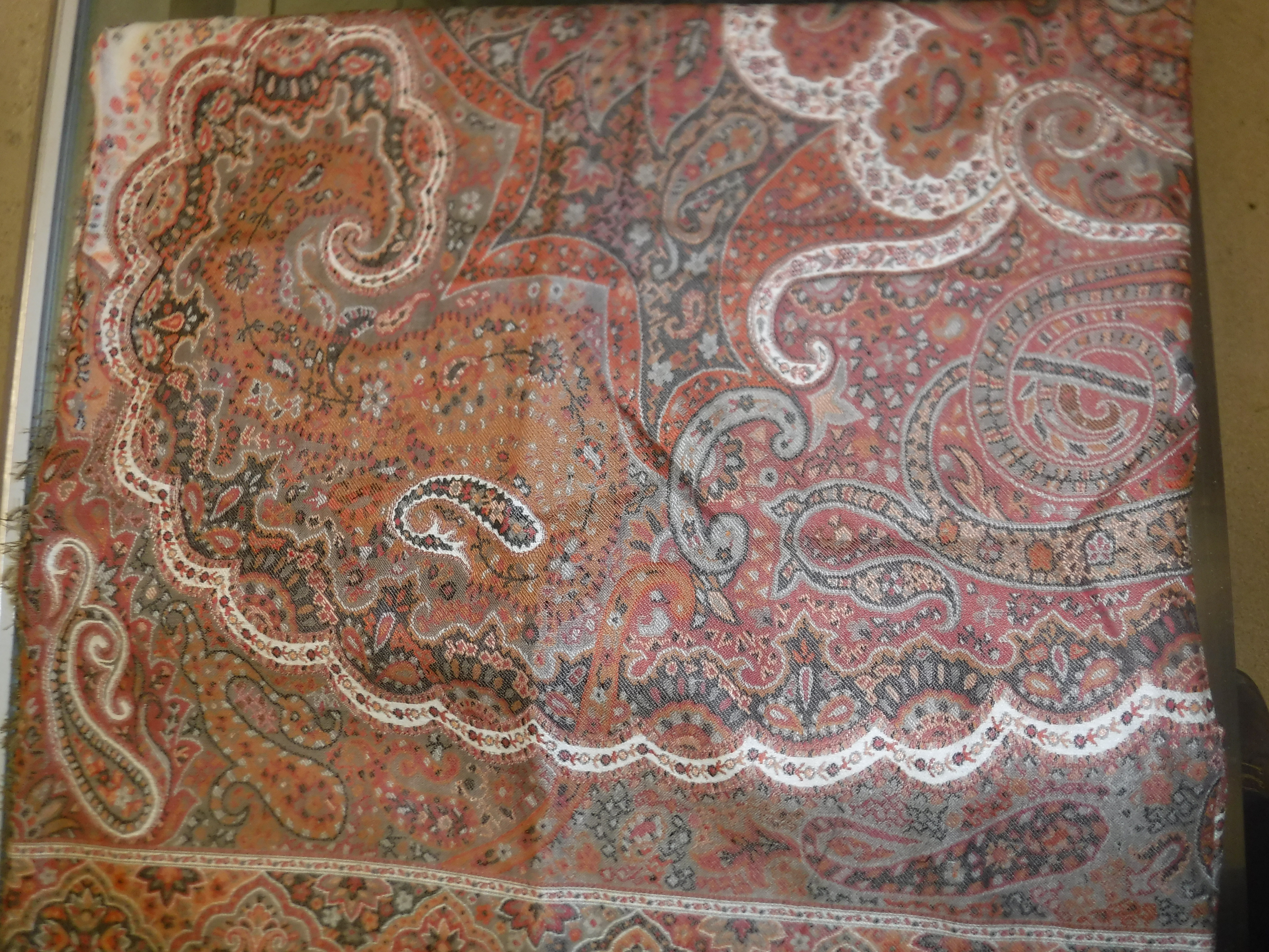 A large modern Paisley shawl or table cover in reds, oxide red, creams, fawn, etc
